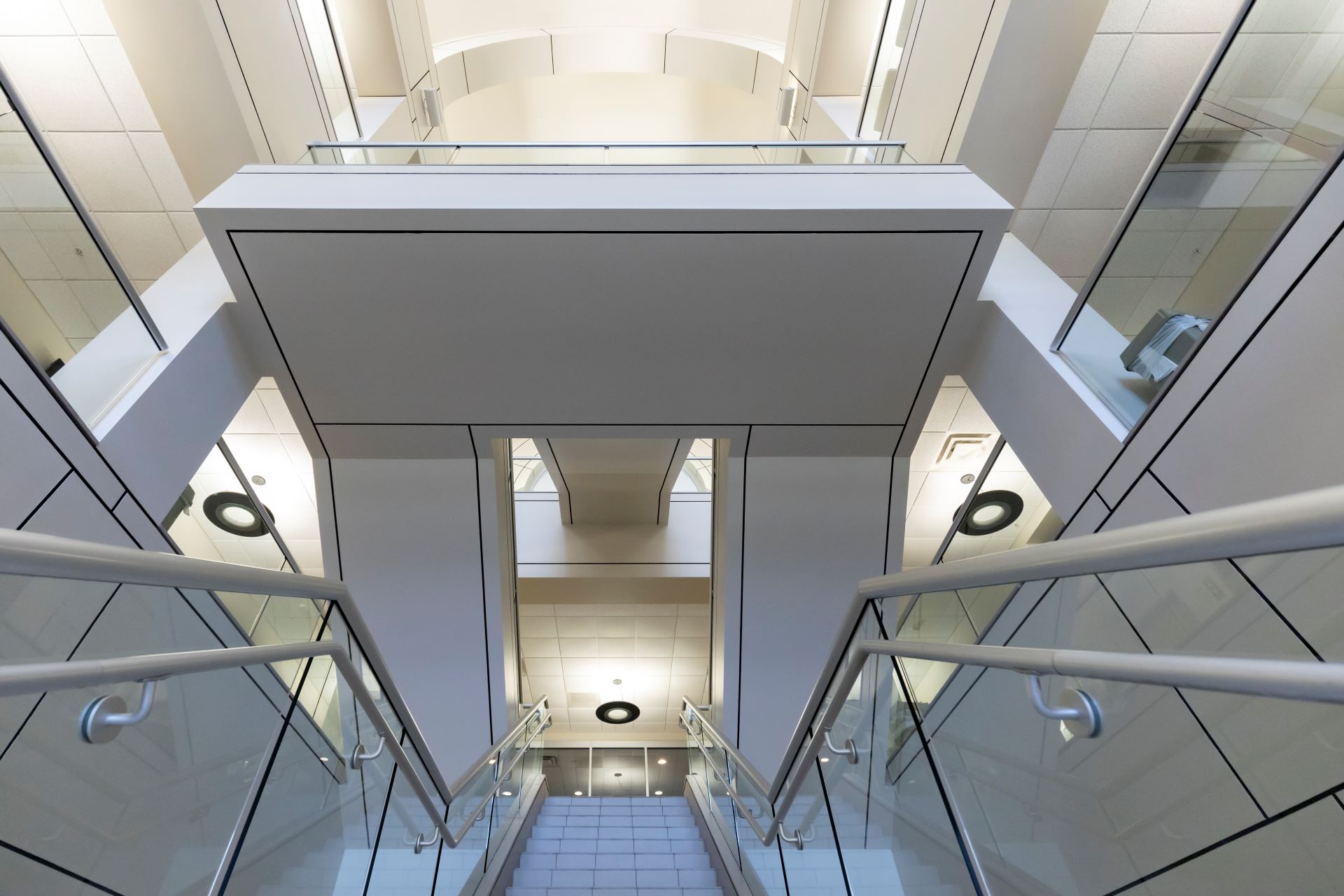 Upward view from the staircase in a hallway